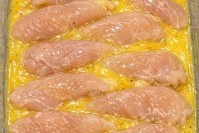 Thumbnail for Toss raw chicken tenderloins in the glass casserole dish and 4 simple pantry staples to get a meal so delicious your whole family will be begging for more!