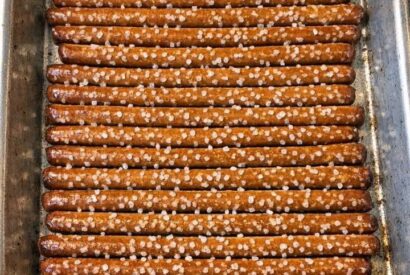 Thumbnail for Toss whole unbroken hard pretzel rods in the sheet pan and 4 additional ingredients to get a dish so delicious your friends will be begging for more!